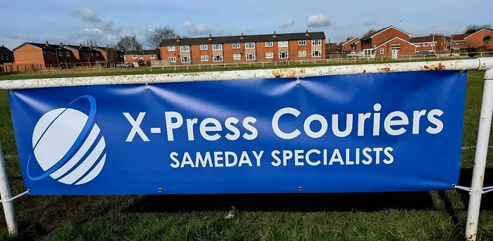 X-Press Couriers sponsor banner beside the first-team pitch at Newton
